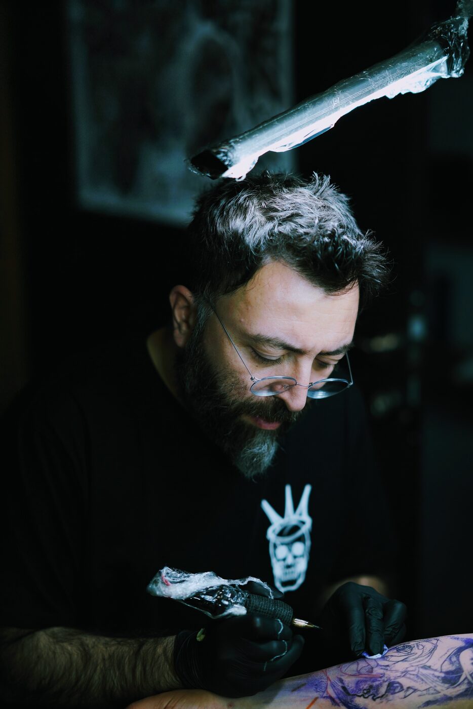 Volkan Demirci tattooing a client in his private studio, Wandsworth, London