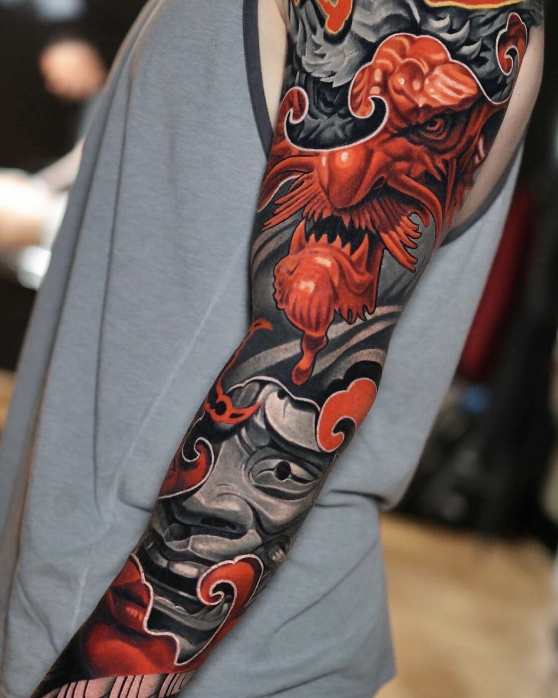 Japanese oni mask sleeve tattoo by Volkan Demirci