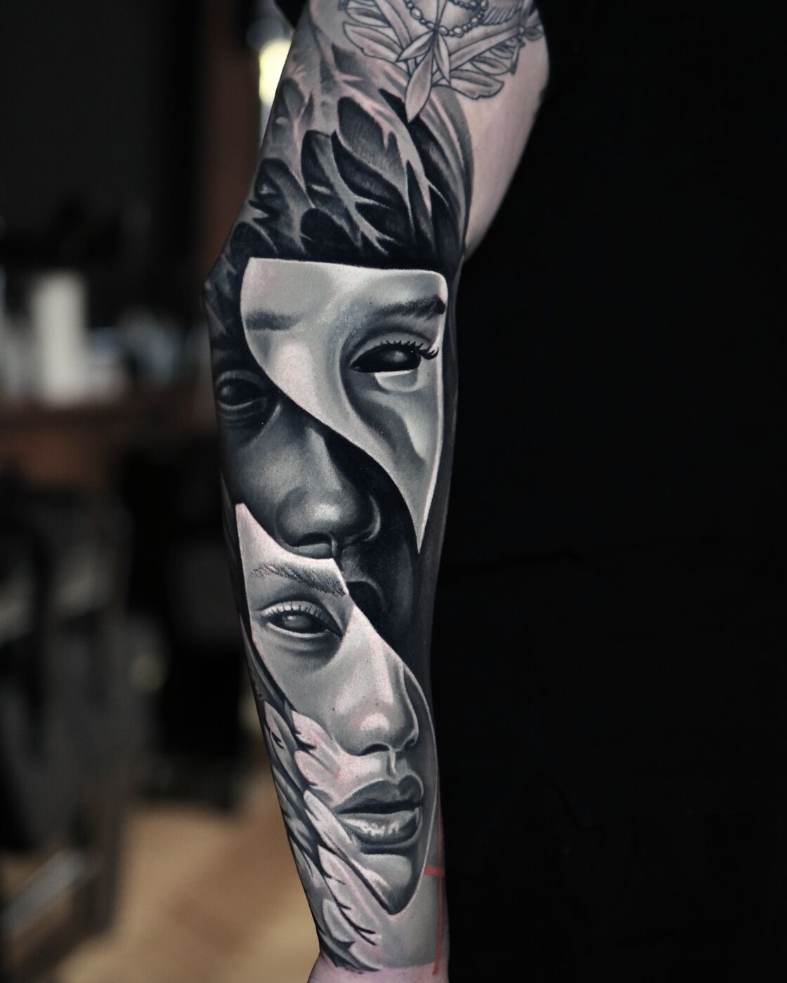 Black and grey surrealist portrait tattoo by Volkan Demirci