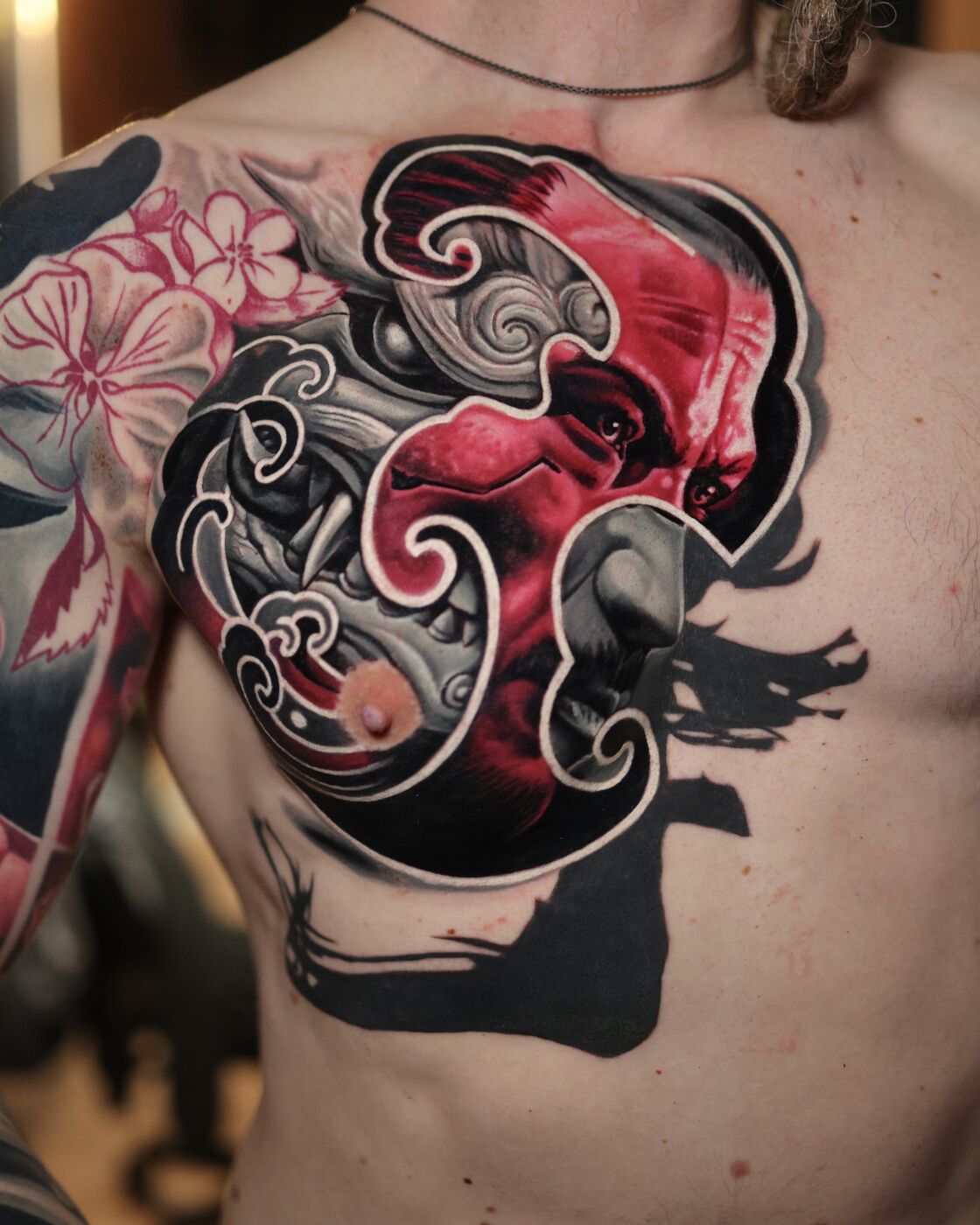 Abstract chest piece tattoo by Volkan Demirci
